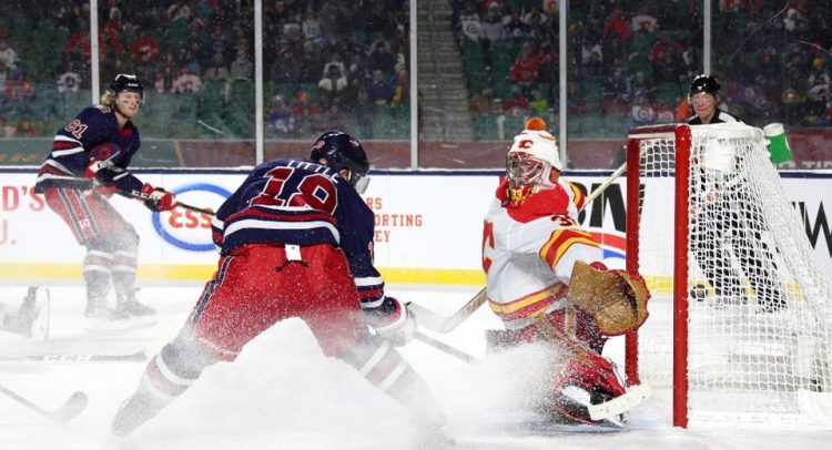 Jets win the Heritage Classic Beating the Flames after OT, 2-1